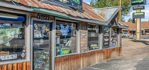 Exterior view of Big Bear Sporting Goods rustic storefront with fishing and outdoor gear signage in Big Bear Lake