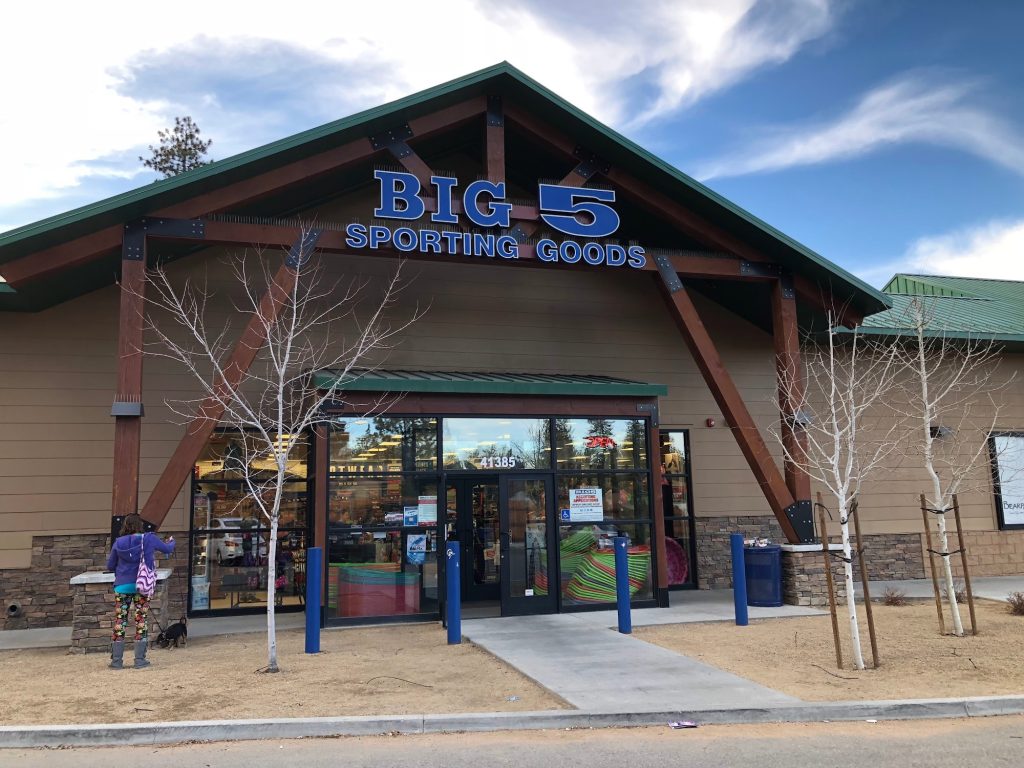 Exterior entrance of Big 5 Sporting Goods retail store with storefront signage and customer entrance.