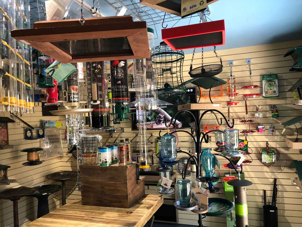 colorful bird feeders and wildlife accessories inside Chirp Nature Center in Big Bear Lake