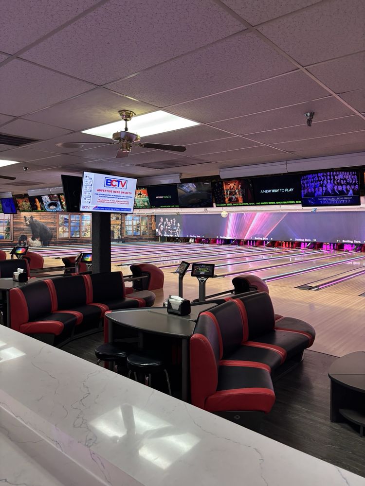 Bowling lanes with lounge seating inside The Bowling Barn Big Bear Lake