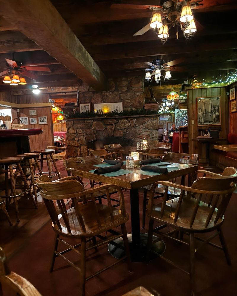cozy indoor dining area with wooden interior and warm lighting at Captain’s Anchorage Big Bear Lake
