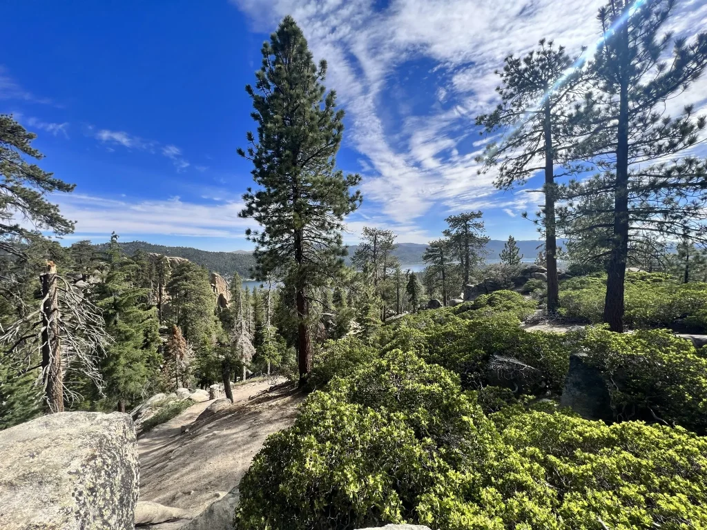 Panoramic vista from Castle Rock Trail, showcasing Lake Tahoe's shimmering surface and the majestic mountain backdrop in Big Bear.