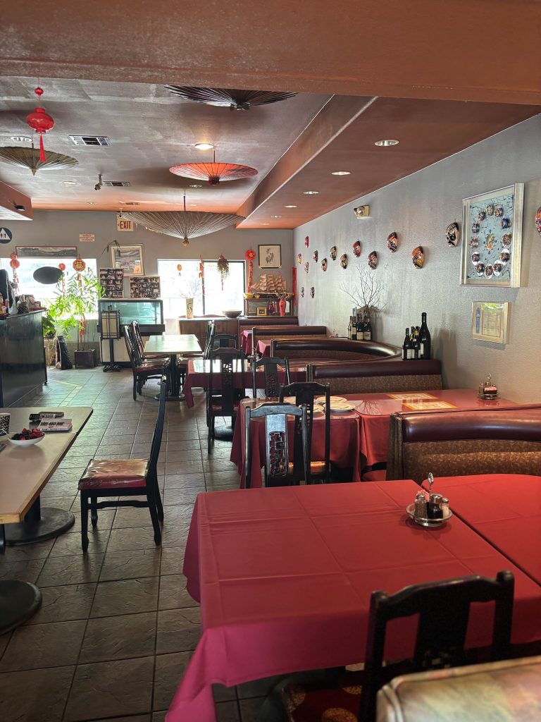 indoor dining area with red tables and traditional decor at Dynasty Chinese Restaurant Big Bear