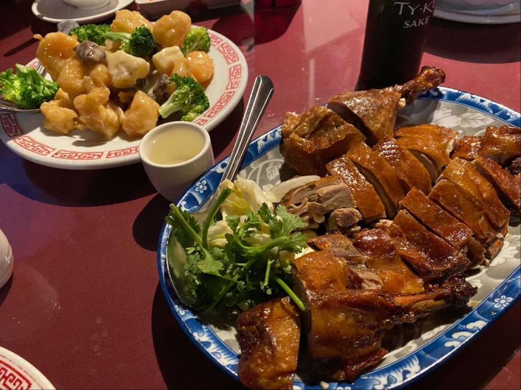roasted duck dish with vegetables and sides at Dynasty Chinese Restaurant Big Bear Lake