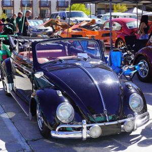 Classic vintage car displayed at a Big Bear automotive event with polished details and a scenic outdoor setting