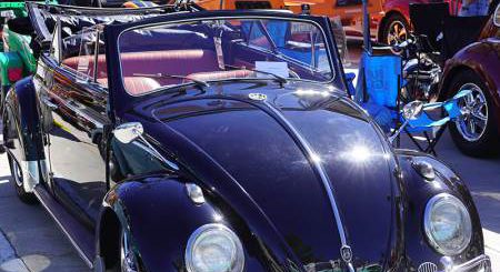 Classic vintage car displayed at a Big Bear automotive event with polished details and a scenic outdoor setting