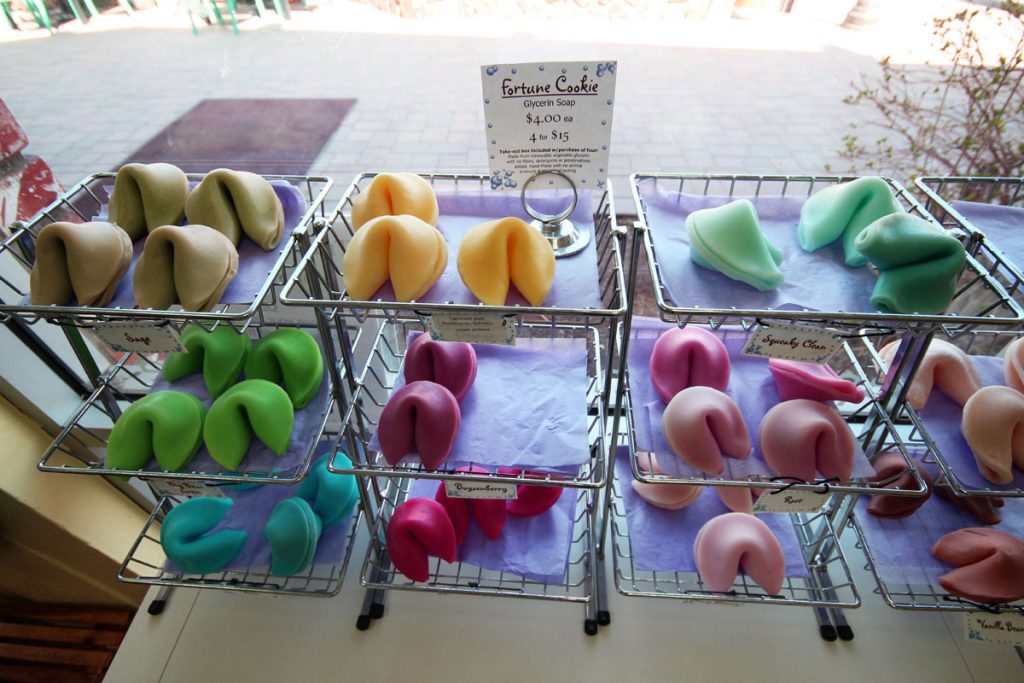 Handmade fortune cookie soaps displayed in baskets at The Bath Workshop