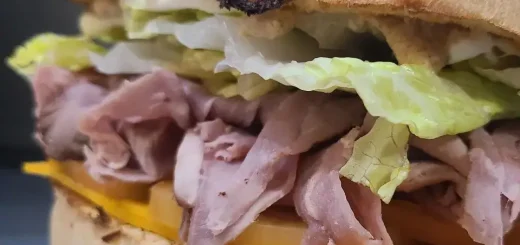 Close-up of a roast beef sandwich on a toasted roll