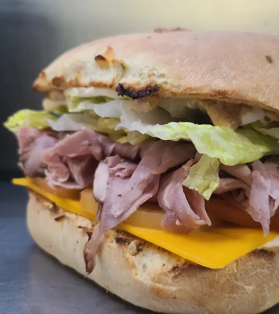 Close-up of a roast beef sandwich on a toasted roll