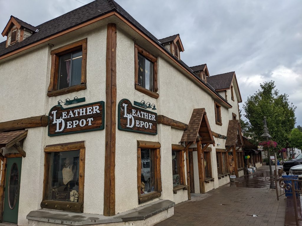 Exterior view of The Leather Depot storefront in Big Bear Village featuring rustic mountain architecture and wooden accents