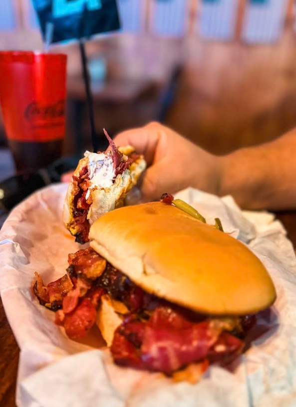 Loaded sandwich with meat and toppings served inside Maggio’s Pizza restaurant in Big Bear Lake