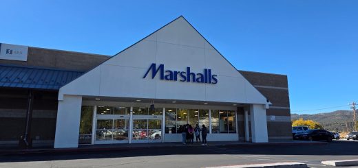 Front entrance of a Marshalls retail store with storefront signage and customer parking area.