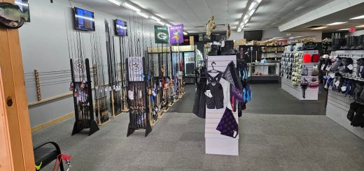 wide interior view of Mountain Top Tackle Shop with fishing equipment and outdoor gear