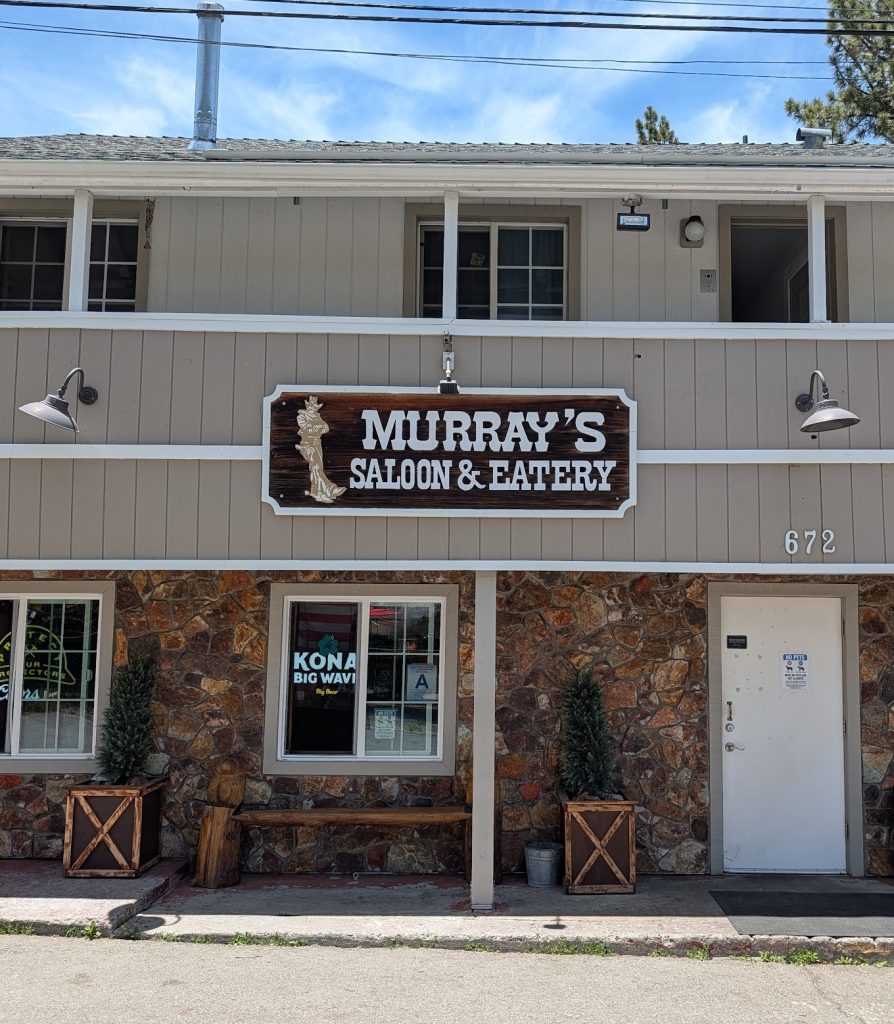 Exterior of Murray's Saloon & Eatery in Big Bear Lake featuring the restaurant sign and storefront entrance