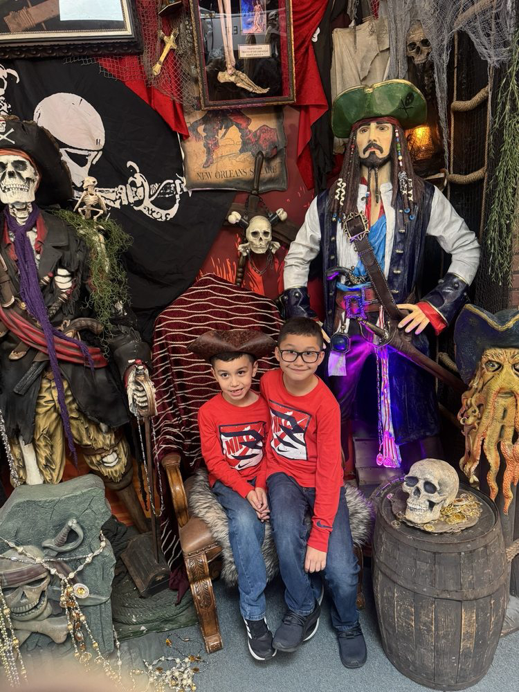 children posing with pirate movie characters and themed props at Hollywood Land in Big Bear Lake