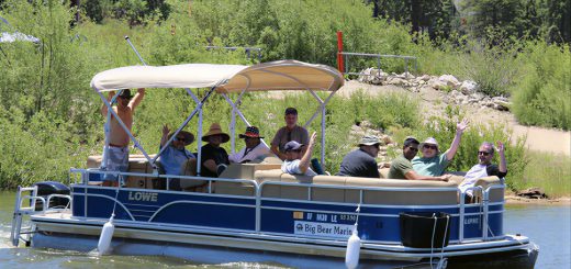 Visitors enjoying a pontoon boat rental on Big Bear Lake from Big Bear Marina