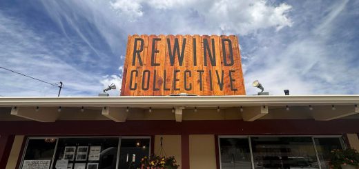 Sign for Rewind Collective displayed on the front of a building in Big Bear.