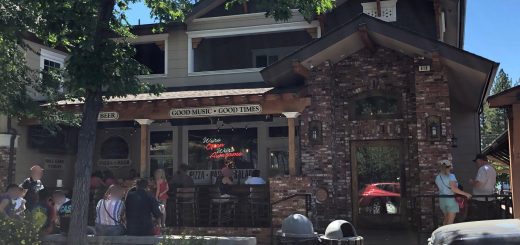 Street view of Saucy Mama’s Pizza and Beer restaurant with outdoor seating in Big Bear Lake