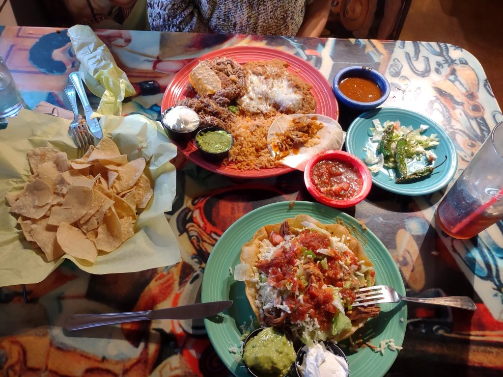 Mexican food spread at Sonora Cantina featuring tacos, rice, chips, salsa, and traditional dishes.