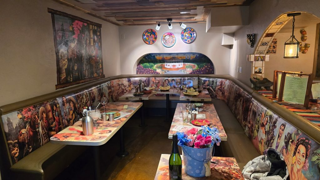 Cozy indoor dining booth area inside Sonora Cantina with colorful Mexican-inspired décor.