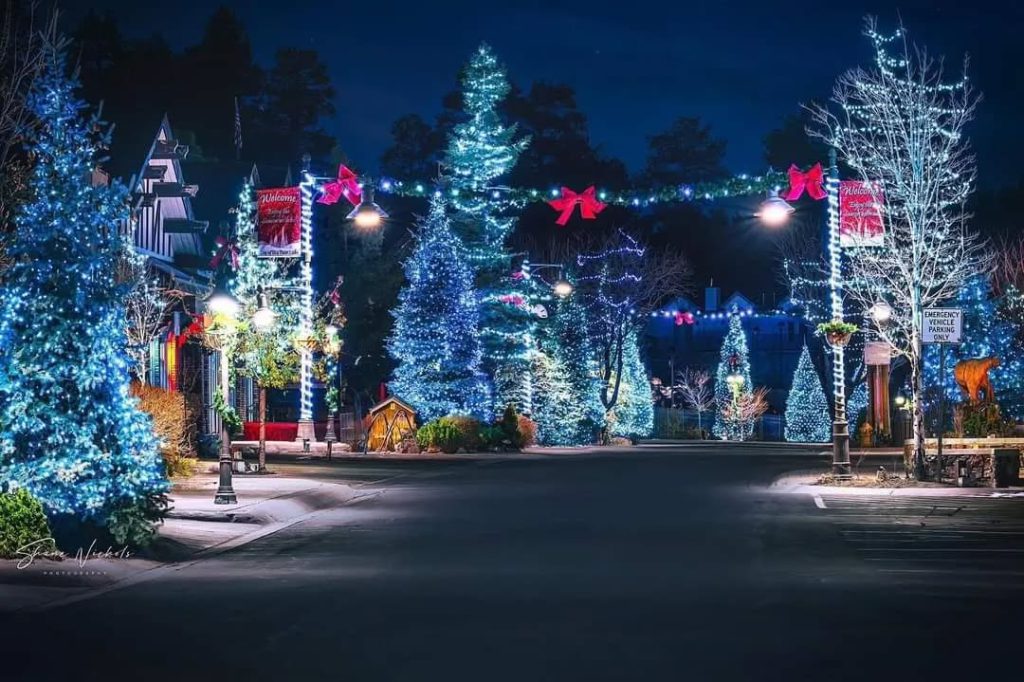 Colorful Christmas lights illuminate the city at night during the Village Christmas Tree Lighting in Big Bear.
