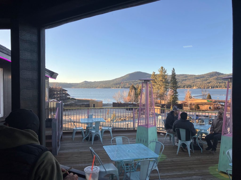 Outdoor patio dining at Tropicali with scenic Big Bear Lake and mountain views